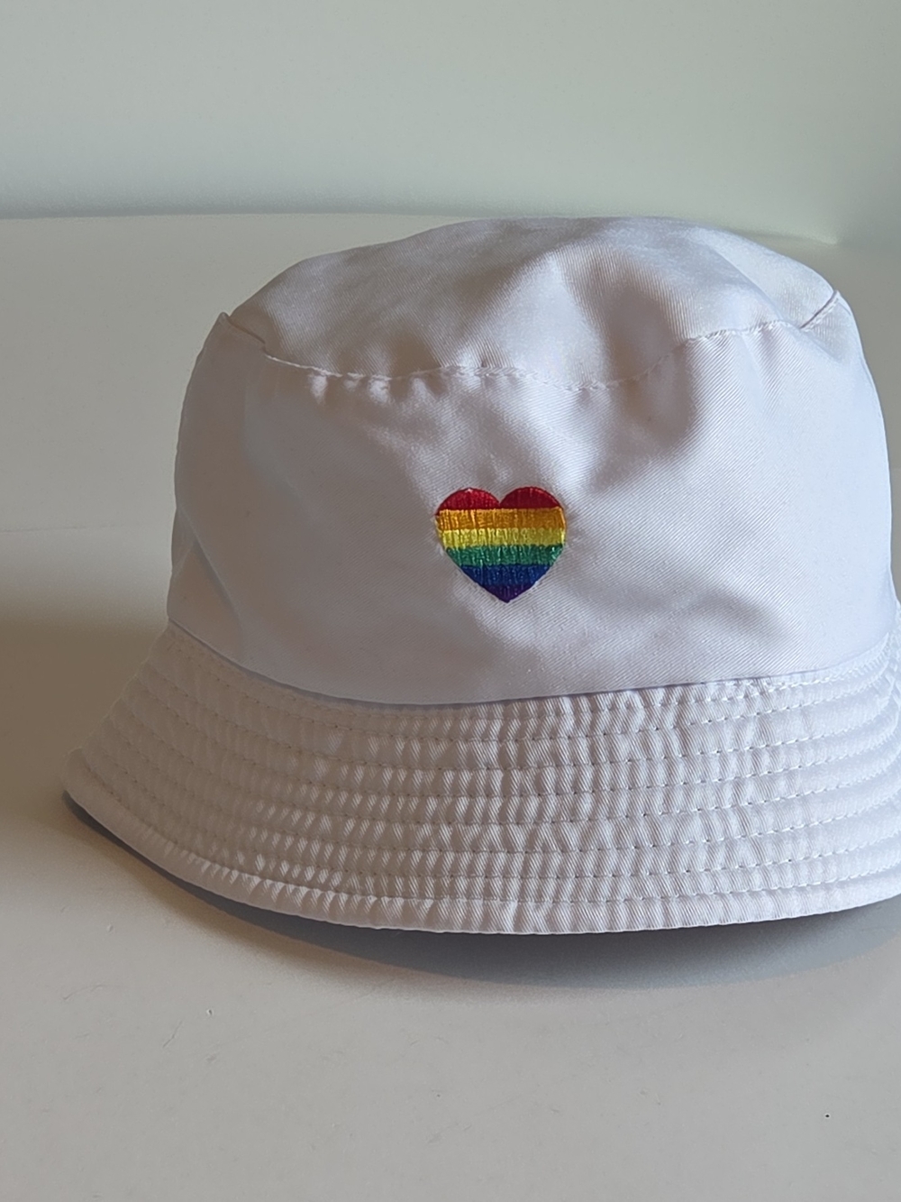 Unisex White Bucket Hat with Embroidered Rainbow Heart Patch